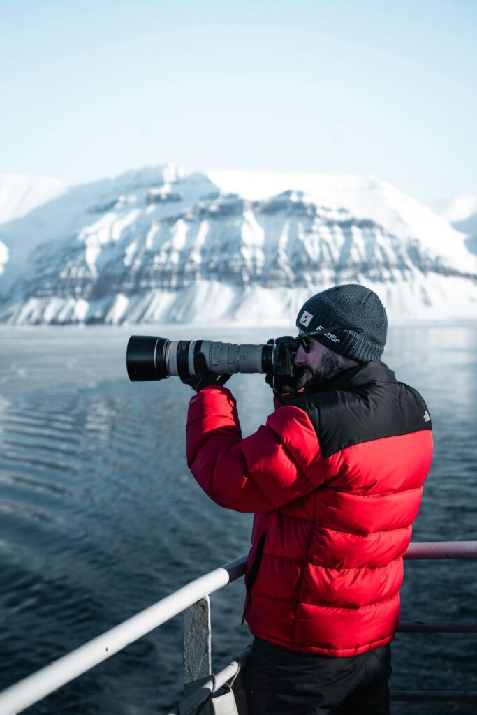 Man taking photo of Antarctica