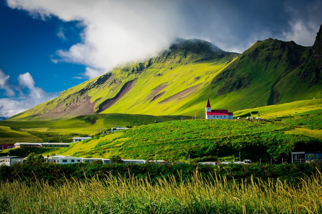green fields and mountains in Iceland